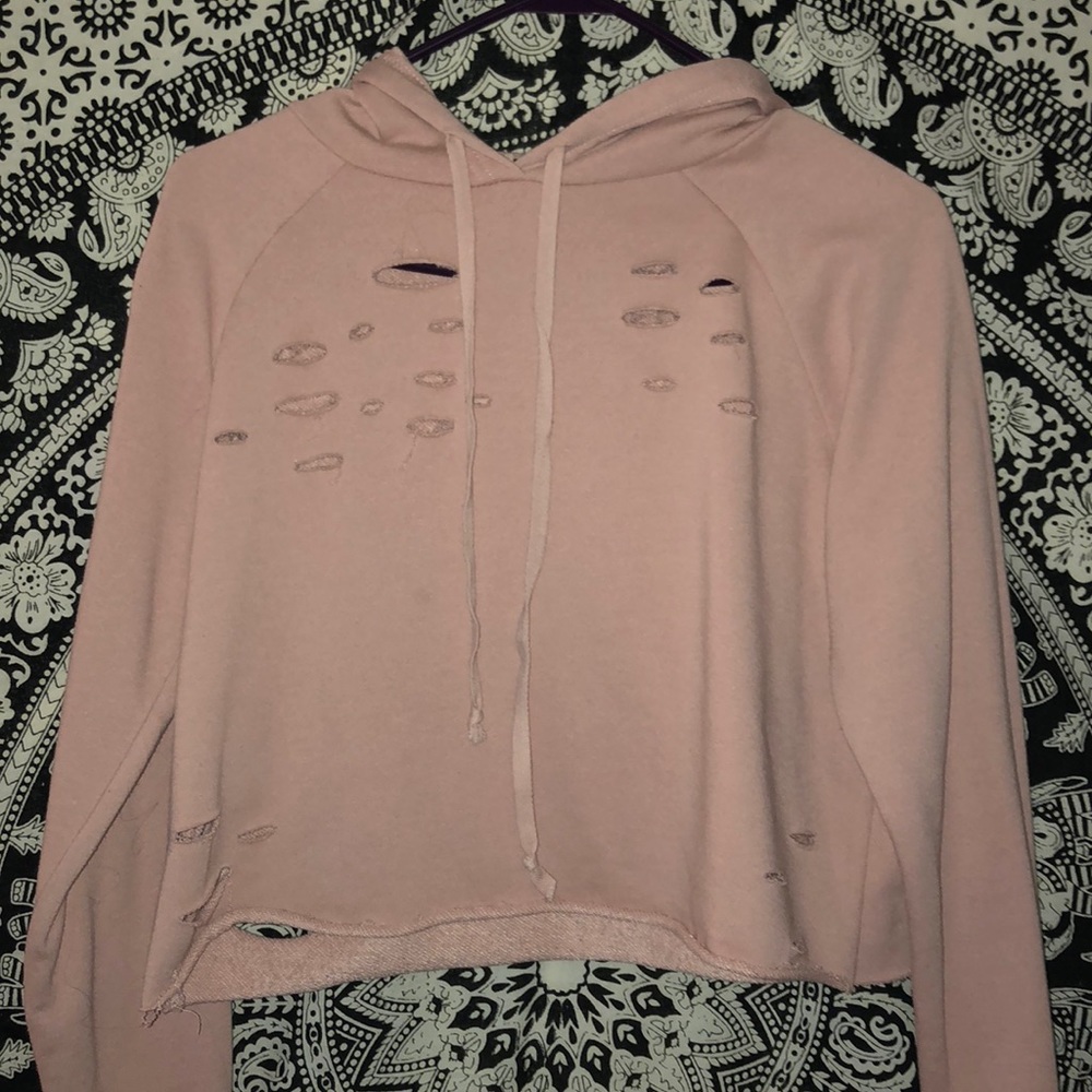 A hoodie from rue 21 with holes, baby pink